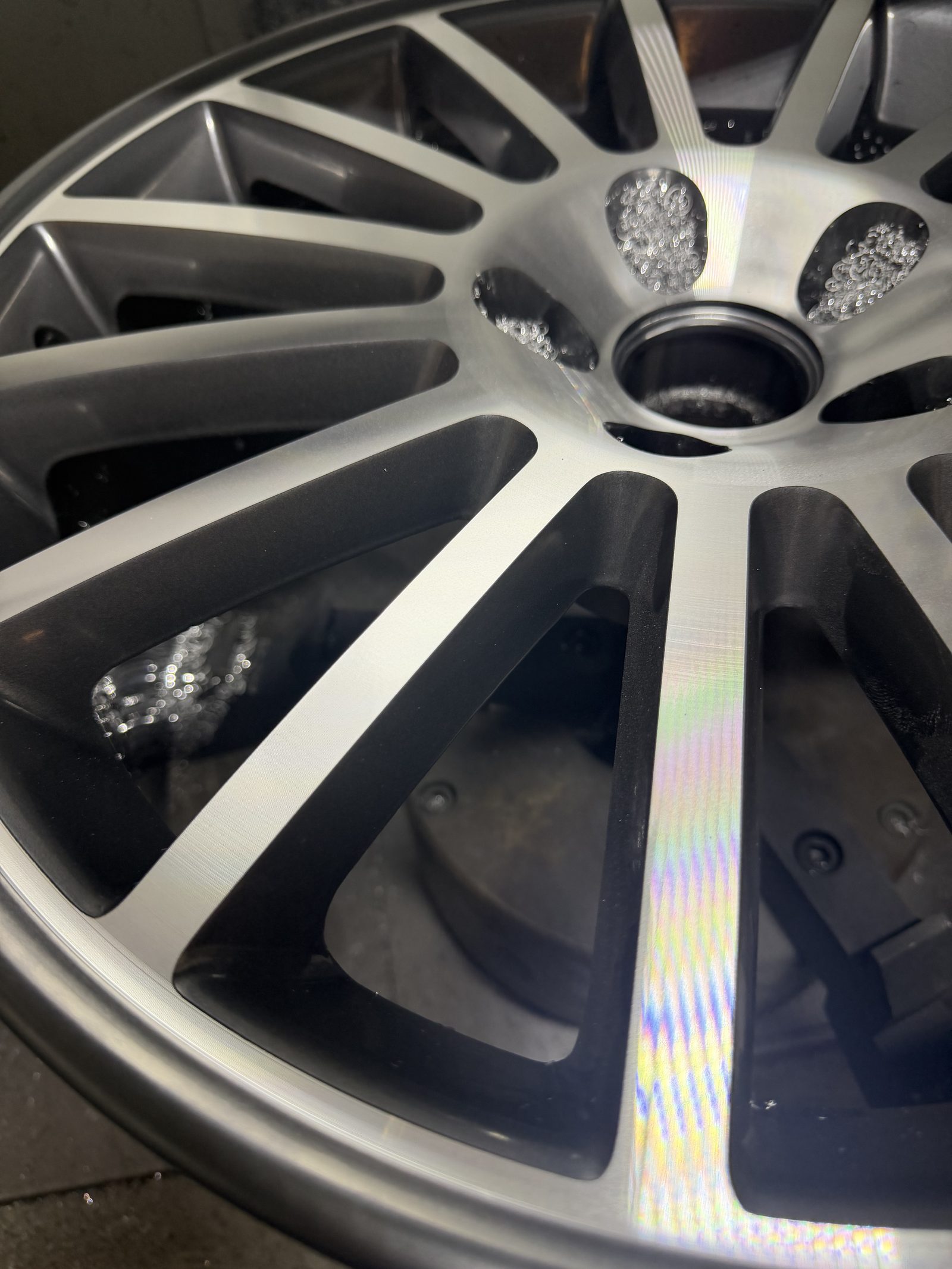 Freshly diamond cut alloy wheel face catching the light at South Wales Alloys in Newport