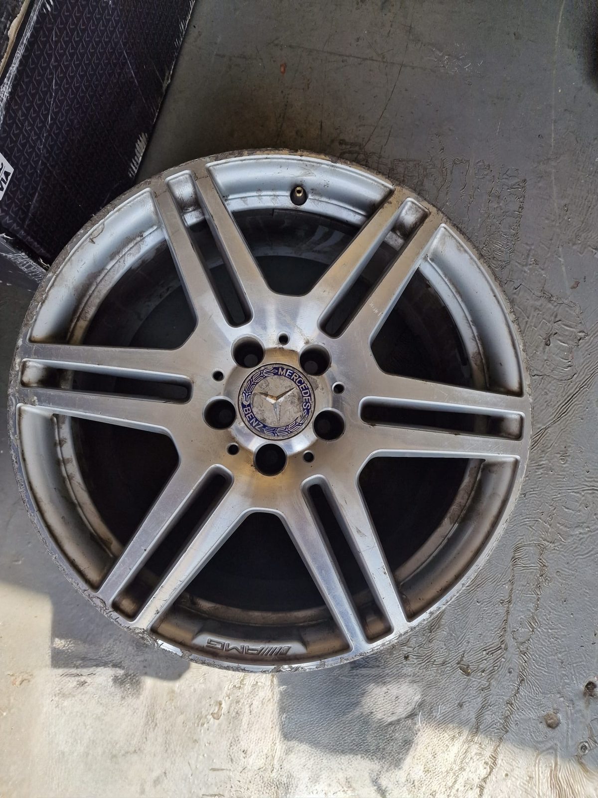 Heavily corroded AMG alloy wheel before refurbishment at South Wales Alloys