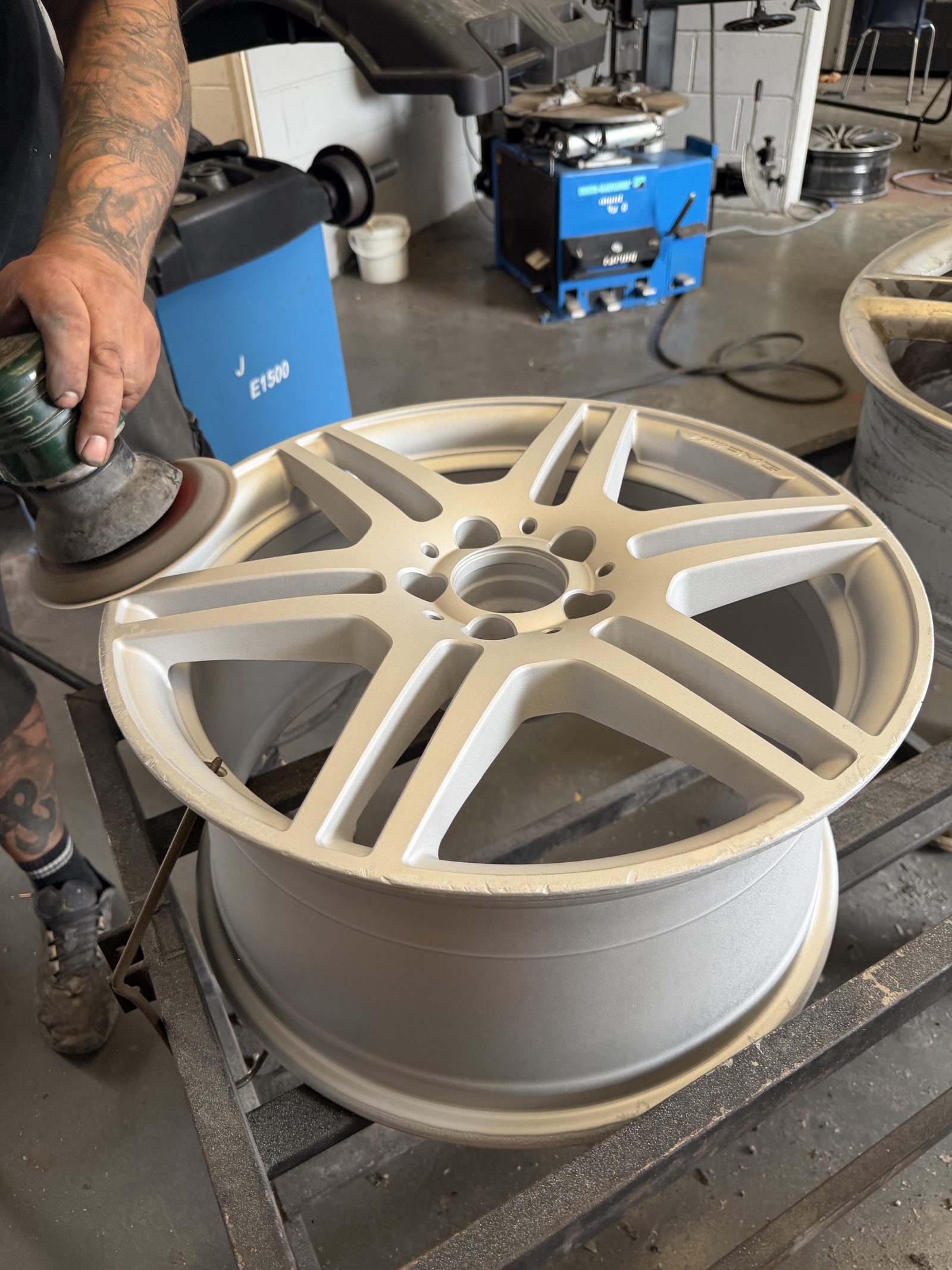 The AMG alloy wheel fully stripped back and in repair at the South Wales Alloys workshop