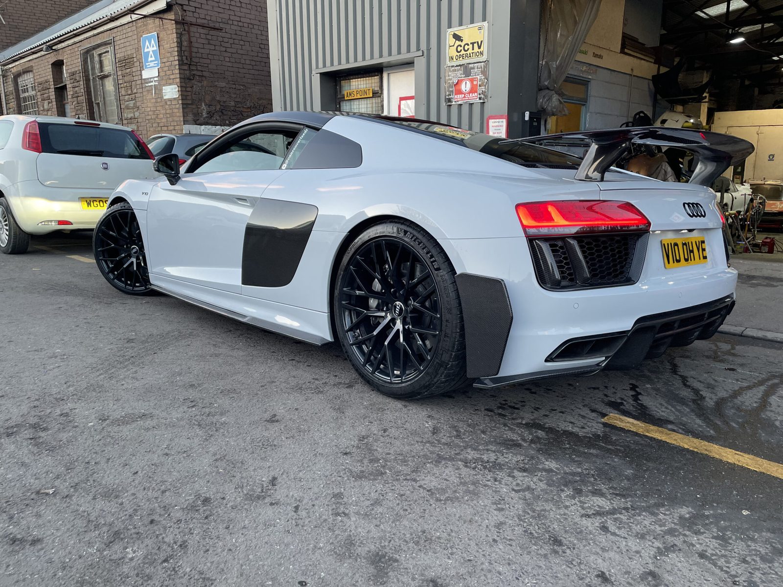 Audi R8 with refurbished alloy wheels outside the South Wales Alloys workshop in Newport